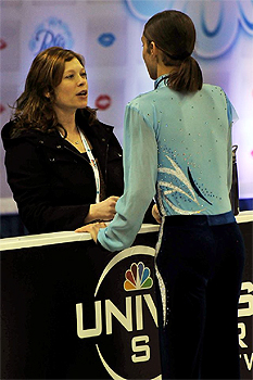 Jason Brown, with coach Kori Ade, at the 2013 U.S. Figure Skating Championship in Omaha, Nebraska. Photo by Leah Adams.