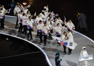 Skaters honored to carry flags at Olympic Opening Ceremony